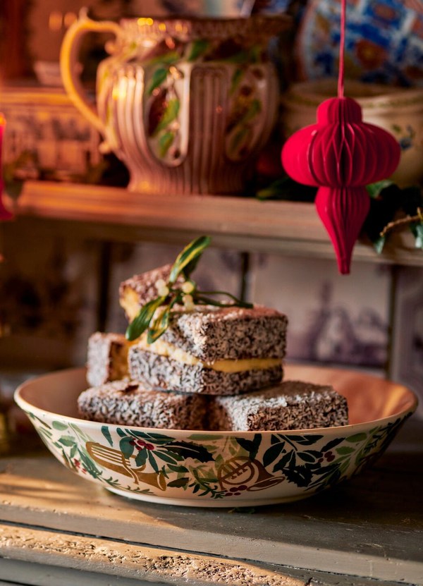 Emma Bridgewater Bring In The Green medium dish holding a Christmas cake