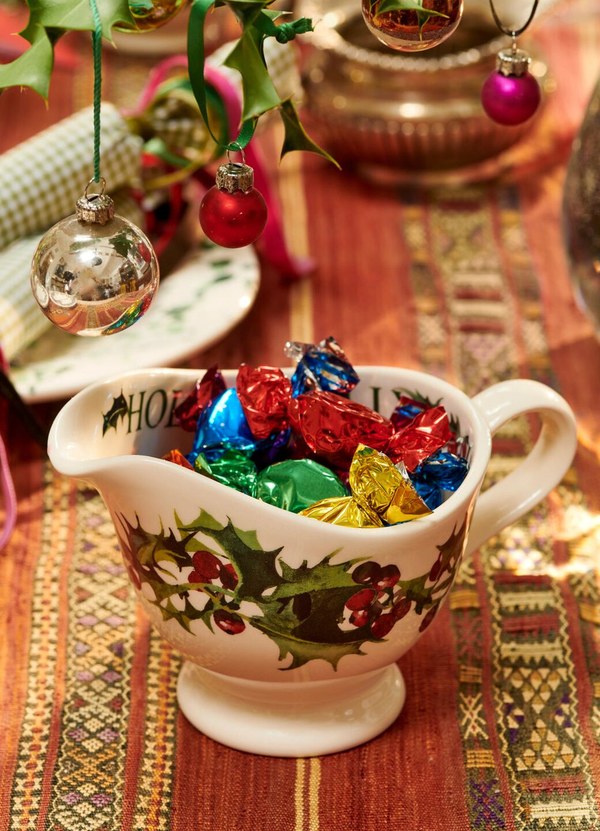 Emma Bridgewater Holly gravy jug and stand filled with Christmas sweets