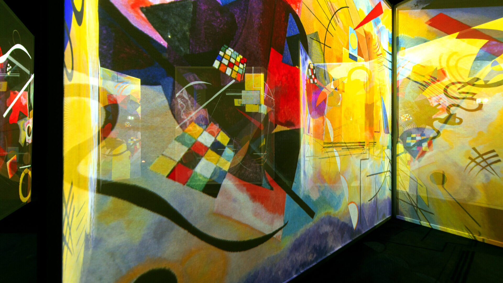 Kandinsky's abstract shapes and colours projected across a room in The Art of Abstraction gallery at FRAMELESS
