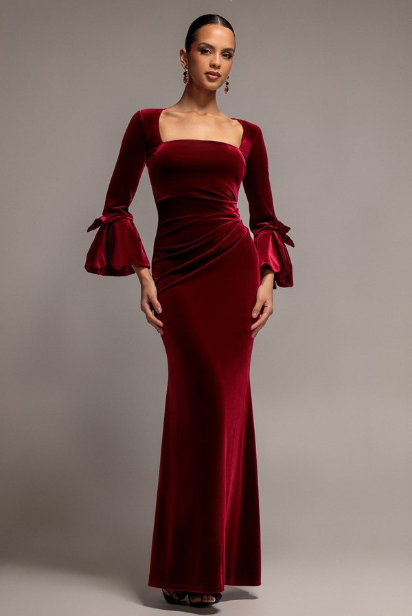 Wine coloured velvet maxi dress with frilled bow sleeves from Goddiva