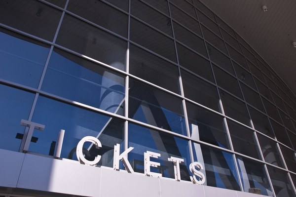 Glass venue frontage with the word TICKETS in large letters