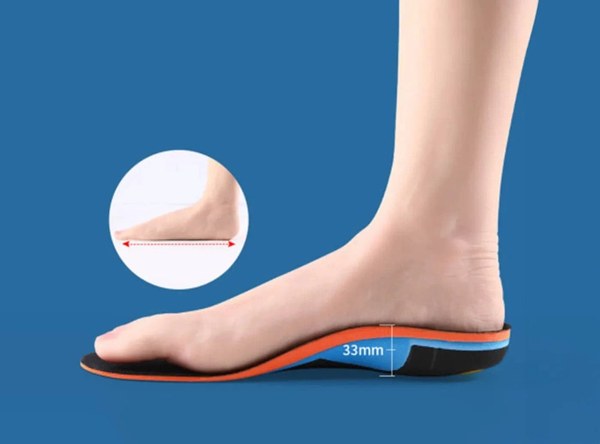 A foot resting on a FitVille plantar fasciitis athletic insole with an orange edge