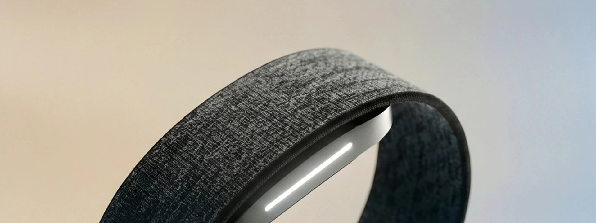 Close-up of the Hume Band 2.0 screenless health wearable with its woven fabric strap