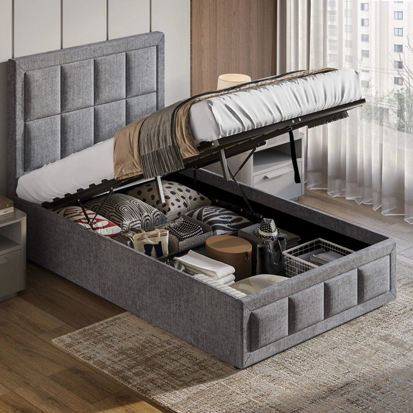 Grey linen ottoman bed with the end lifted to show the storage space filled with bedding