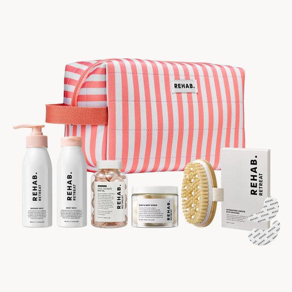 REHAB. Time to Retreat Set with a striped wash bag, body care and a brush
