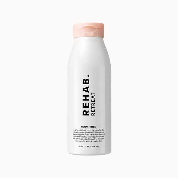 White REHAB. Retreat Body Milk bottle with a pink cap